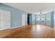 Spacious living room with wood floors and a big bay of windows at 2465 Brianna Dr, Hampton, GA 30228