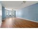 Large living room featuring wood floors and a bay of windows at 2465 Brianna Dr, Hampton, GA 30228