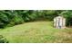 Spacious backyard featuring a storage shed and lush greenery at 3213 Jamaica Nw Rd, Atlanta, GA 30318