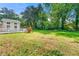 Large backyard featuring a well maintained lawn and a deck for relaxing and entertaining at 4590 Sims Ct, Tucker, GA 30084
