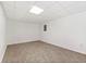Unfinished basement featuring tile flooring, painted white walls, and drop ceiling with a single light at 4590 Sims Ct, Tucker, GA 30084
