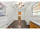 Cozy dining room featuring hardwood floors, fan, and multiple doorways at 4590 Sims Ct, Tucker, GA 30084