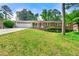 Charming brick home featuring a well-maintained front yard and attached garage, perfect for suburban living at 4590 Sims Ct, Tucker, GA 30084