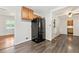 Contemporary kitchen featuring modern appliances, wood cabinets, and eat-in area at 4590 Sims Ct, Tucker, GA 30084