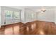 Inviting living room featuring beautiful hardwood floors, ceiling fan and well-lit neutral paint at 4590 Sims Ct, Tucker, GA 30084