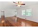 Inviting living room with gleaming hardwood floors, ceiling fan, and plenty of natural light at 4590 Sims Ct, Tucker, GA 30084