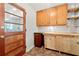Mud room features wood cabinets, tile floors, butcher block, and a wooden door with glass panels at 4590 Sims Ct, Tucker, GA 30084
