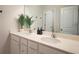 Elegant bathroom with dual sinks, modern fixtures, and stylish decor, perfect for a luxurious experience at 688 Saffron Blvd, Lawrenceville, GA 30045