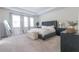 Spacious bedroom boasts lots of natural light, neutral decor, and modern furnishings at 688 Saffron Blvd, Lawrenceville, GA 30045