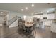 Spacious dining area that is open to a well-appointed modern kitchen with stainless steel appliances at 688 Saffron Blvd, Lawrenceville, GA 30045