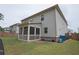 A neutral toned two-story home with a private screened porch and spacious backyard ready for outdoor living at 688 Saffron Blvd, Lawrenceville, GA 30045