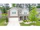 Charming two-story home featuring a brick facade, covered porch, and well-manicured front yard at 688 Saffron Blvd, Lawrenceville, GA 30045