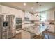 Bright kitchen featuring stainless appliances, a central island and modern hardware at 688 Saffron Blvd, Lawrenceville, GA 30045