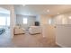 Bright living room with neutral tones, plush seating, and natural light creating a cozy and inviting atmosphere at 688 Saffron Blvd, Lawrenceville, GA 30045