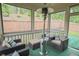 Relax in this screened in porch, complete with seating, pillows and a propane heater for use in cooler months at 688 Saffron Blvd, Lawrenceville, GA 30045