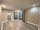 Another room showcasing the wood flooring and connecting rooms with open french doors at 3079 Colonial Way # J, Atlanta, GA 30341