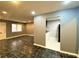 Open floor plan showcases living room flowing into the kitchen, with dark tile flooring at 3079 Colonial Way # J, Atlanta, GA 30341