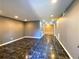 Spacious living room featuring sleek, dark tile floors and recessed lighting at 3079 Colonial Way # J, Atlanta, GA 30341