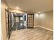 Bright living space showcasing a hardwood floor, recessed lighting, and connecting rooms at 3079 Colonial Way # J, Atlanta, GA 30341