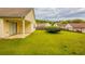 Spacious backyard with lush green grass and a covered patio area at 3531 Brookstone Way, Union City, GA 30291