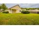 Exterior of home featuring a spacious lawn, perfect for outdoor activities and entertainment at 3531 Brookstone Way, Union City, GA 30291