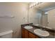 Bathroom featuring a double sink vanity, neutral walls, and a large mirror at 3531 Brookstone Way, Union City, GA 30291