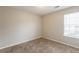 A cozy carpeted bedroom with a window that provides plenty of natural light at 3531 Brookstone Way, Union City, GA 30291