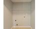 A basic closet showing wire shelving, electrical outlet, and a round duct on the wall at 3531 Brookstone Way, Union City, GA 30291