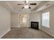 Open-concept living area with a fireplace, neutral colors, and ample space for furnishings and relaxation at 3531 Brookstone Way, Union City, GA 30291