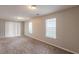 Open-concept living area with new carpeting and a sliding glass door leading to the backyard at 3531 Brookstone Way, Union City, GA 30291