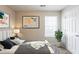 Stylishly decorated bedroom with modern art, comfy bed, and a window with natural light at 3531 Brookstone Way, Union City, GA 30291