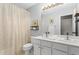 A bright bathroom features double sinks, neutral walls, and great lighting at 5010 Foxberry Ln, Roswell, GA 30075