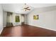 Spacious bedroom with vaulted ceiling, hardwood floors, and large window at 5010 Foxberry Ln, Roswell, GA 30075