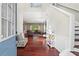 Inviting foyer with hardwood floors leading into an open floor plan with lots of natural light at 5010 Foxberry Ln, Roswell, GA 30075