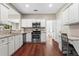 Bright kitchen with stainless steel appliances and hardwood floors at 5010 Foxberry Ln, Roswell, GA 30075