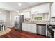 Bright kitchen with stainless steel appliances and an adjacent breakfast area at 5010 Foxberry Ln, Roswell, GA 30075