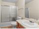 Functional bathroom featuring a shower-tub combo, neutral walls, and ample counter space at 142 Old Hampton Way, Hampton, GA 30228