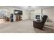 Spacious living room with a fireplace, built-in shelving, and neutral carpeting at 142 Old Hampton Way, Hampton, GA 30228