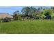 Well-maintained backyard with green grass and a black metal fence, providing privacy at 205 Kestrel Cir, Covington, GA 30014