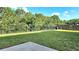 Expansive fenced backyard featuring well-maintained lawn and a private wooded backdrop at 205 Kestrel Cir, Covington, GA 30014