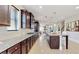 The well-equipped kitchen includes granite countertops, a large island with seating, and stainless steel appliances at 205 Kestrel Cir, Covington, GA 30014