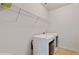 Laundry room featuring a white washer and dryer and wire shelving for storage at 205 Kestrel Cir, Covington, GA 30014