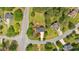 An aerial view of a home on a corner lot with mature trees and a long driveway in a wooded neighborhood at 21 Collins Dr, Douglasville, GA 30134