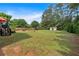 Large backyard with playhouse, fire pit, and plenty of room for recreation and entertainment at 21 Collins Dr, Douglasville, GA 30134
