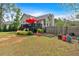 Spacious backyard view showcasing the home's deck, lush greenery, and potential for outdoor activities and gardening at 21 Collins Dr, Douglasville, GA 30134