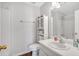 Clean bathroom featuring modern fixtures, a combined shower and tub, and ample storage space at 21 Collins Dr, Douglasville, GA 30134