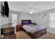 This bedroom is equipped with a ceiling fan, TV, and an artistic design on the wall at 21 Collins Dr, Douglasville, GA 30134