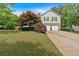 Charming two-story home featuring stone accents, a well-manicured lawn, and an attached two-car garage at 21 Collins Dr, Douglasville, GA 30134