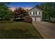 Charming two-story home featuring stone accents, a well-manicured lawn, and an attached two-car garage at 21 Collins Dr, Douglasville, GA 30134