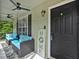 Inviting covered front porch with stylish seating and a view of the neighborhood at 21 Collins Dr, Douglasville, GA 30134